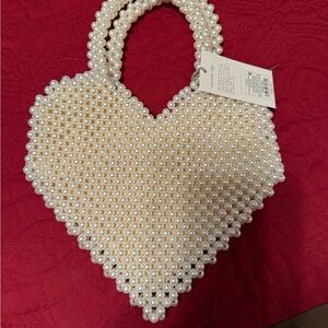 Cute little heart shaped pearl bag with tags